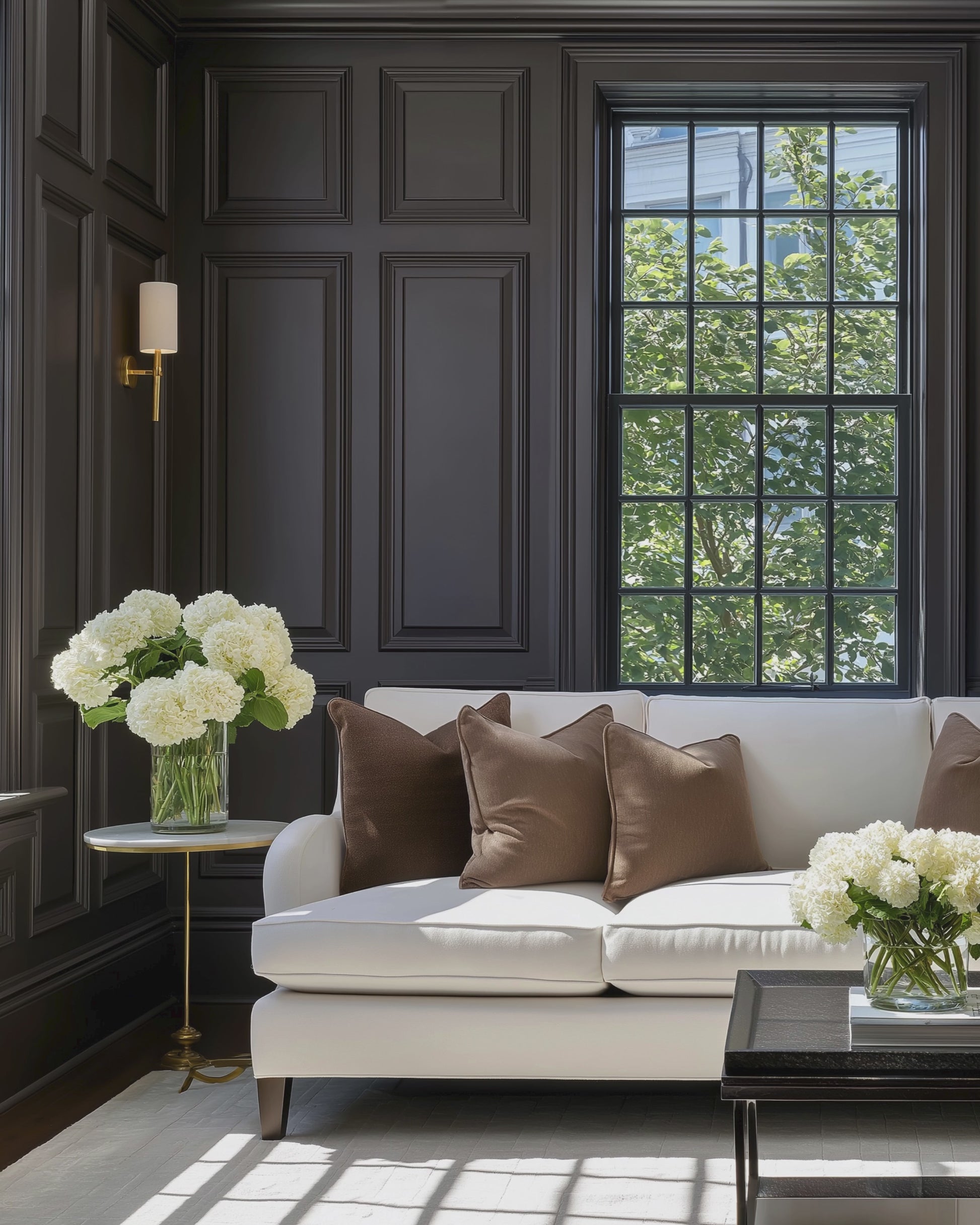 Moody traditional interior with warm wood tones and color-drenched classic details